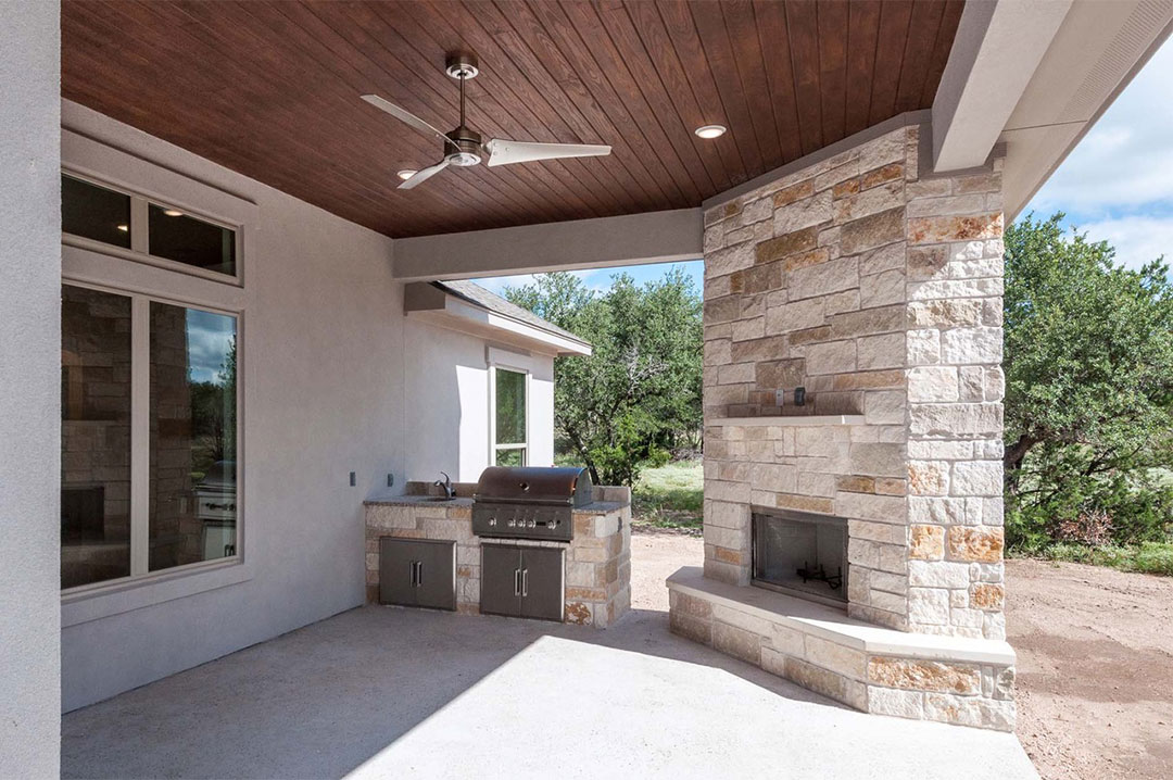 201 Vista View Marble Falls Texas dining area back porch fireplace and grill